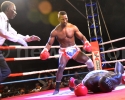 Referee Charles Wandera moves in as Moses Golola knocks down Tugume in the first round of their scheduled seven round fight of the  East and Central Africa Championship title match at Freedom City, August 30 2013. PICTURE BY MICHAEL NSUBUGA